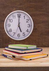 notepad or paper notebook at wooden table background