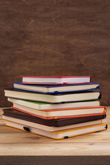 notepad or paper notebook at wooden table