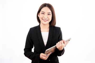 Asian businesswoman with black suit holding a laptop with big smile beaming face in white isolated...