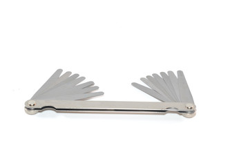 Stainless steel double end feeler gauge on white background