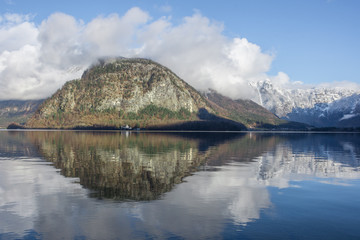 The clear water of Hallstattersee lake and the beautiful mountains surrounding it in Salzkammergut region, Austria, in winter