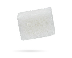 Piece of refined sugar isolated on a white background