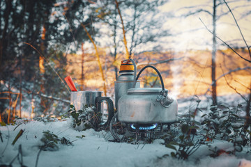 Cooking while hiking with a backpack.