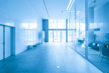 Empty floor tile and glass window in art center interior space
