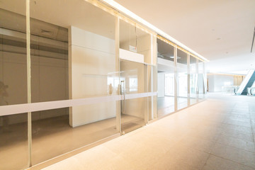 Empty floor tile and glass window in art center interior space
