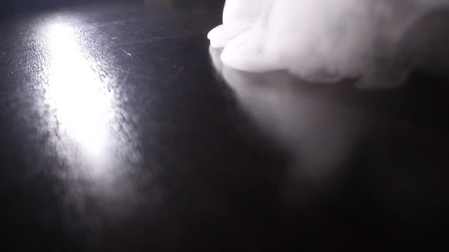 white smoke on a black background. Slow motion. Vape smoke. Vapor , fog, ice smoke cloud , realistic smoke cloud best for using in 4k composition.