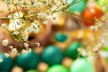 Many Easter eggs decorated with floral branches