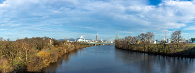 view to Hoechst industry area with bridge spanning river Main in Frankfurt