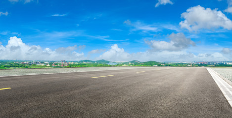 Wide asphalt highway and city suburb skyline on a sunny day in Shanghai,panoramic view.