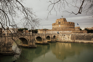 Fototapeta na wymiar View of Tiber River, Castle of the Holy Angel usually known as Mausoleum of Hadrian and Aelian Bridge built in ancient Rome, Italy. It is now the famous tourist attraction of Italy. 