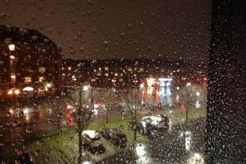 Raining night behind the window