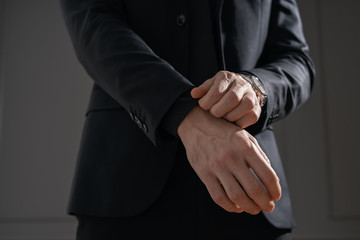 Obraz premium Young handsome businessman in black shirt and black suit