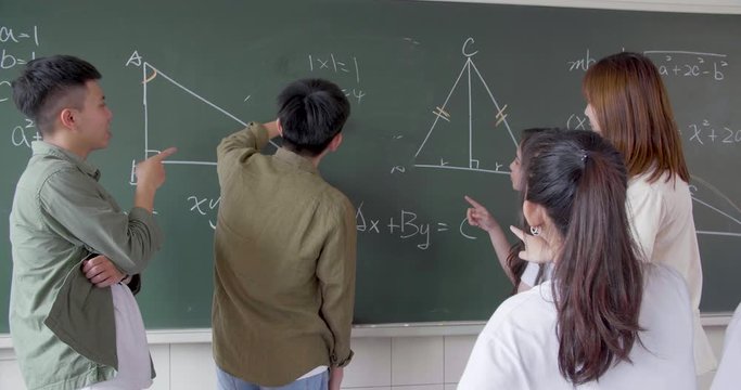 Group of student working on the mathematical problem