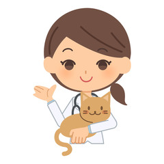 説明をする獣医と猫