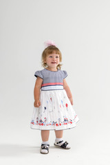 portrait of a little beautiful girl 2-3 years old with a pink bow