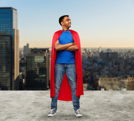 super power and people concept - happy smiling indian man in red superhero cape with crossed arms...