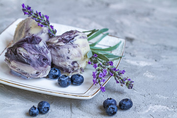 sweet cold dessert, classic lavender ice cream with blueberry syrup