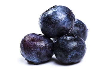 a handful of blueberries close-up isolated on white background