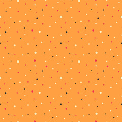 Seamless pattern with colourful dots of different diameters on an orange background. Vector illustration.