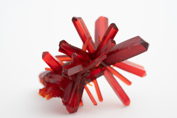 Red crystal of natural origin. Natural geological material for use in technology and jewelry
