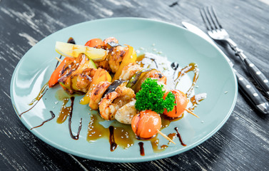 Shrimp and vegetable skewer on grill closeup