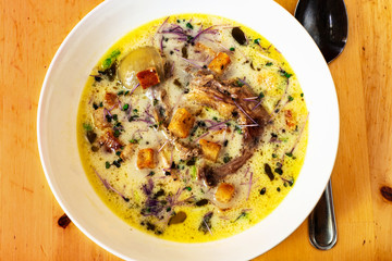 Rich thick hen soup, closeup.