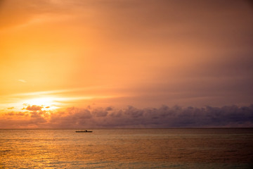 sunset in a beach in maldives islands