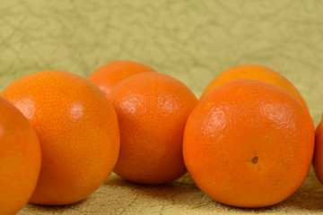 fresh tangerines on a green background