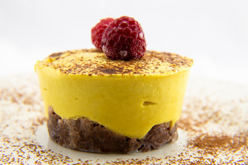 Frozen Strawberry on top of mango raw cake