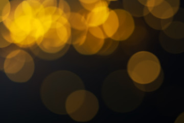 Abstract golden and black backdrop with bokeh