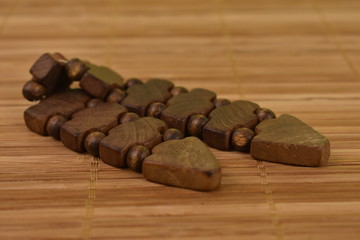 rosary on a straw background
