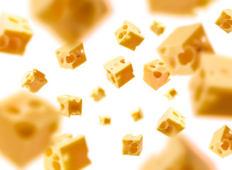 Cheese cubes levitate on a white background - obrazy, fototapety, plakaty