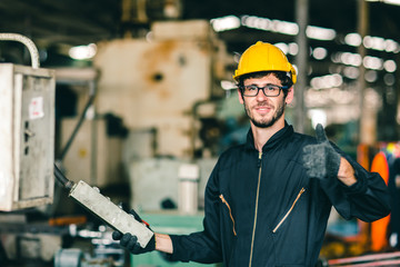 glasses nerdy worker show thumb up happy working in factory, industrial engineer man enjoy to work...