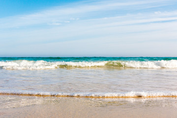 Bursts of sea waves on a tropical sea beach,
