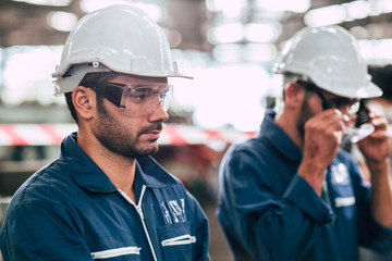Head of engineer, worker leader portrait self confidence and professional look wearing safty glasses and white helmet.