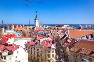 Panoramic view, aerial skyline of Old City Town, Toompea Hill, St. Olaf Baptist Church, architecture, roofs of houses and landscape, Tallinn, Estonia. 
