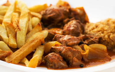 Traditional Greek Beef Stifado with rice and french fries.