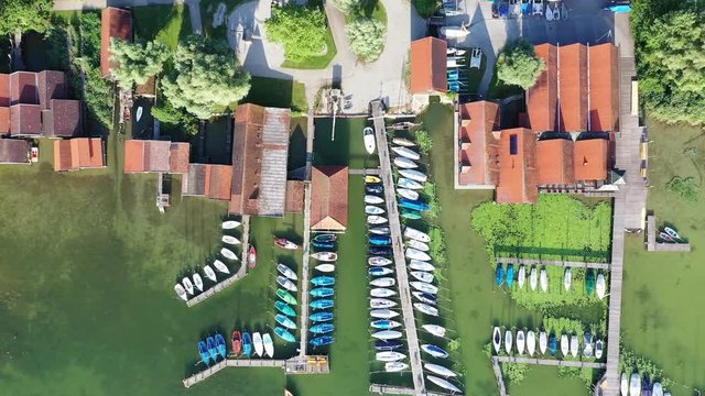 Aerial of boat houses at and jetties at lake Ammer, Bavaria, Germany