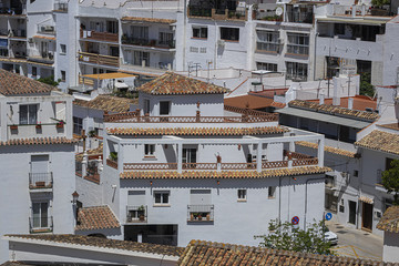 Fototapeta premium Beautiful aerial view of Mijas - Spanish hill town overlooking the Costa del Sol, not far from Malaga. Mijas known for its white-washed buildings. Mijas, Andalusia, Spain.
