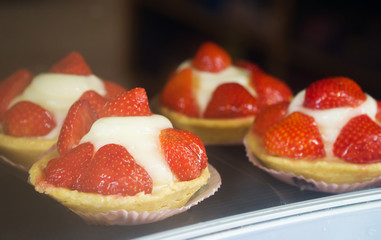 Close-up view of Custard baskets with strawberries.