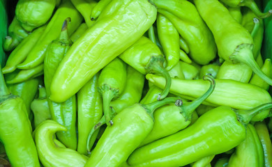 Close-up view of organic green peppers in supermarket.