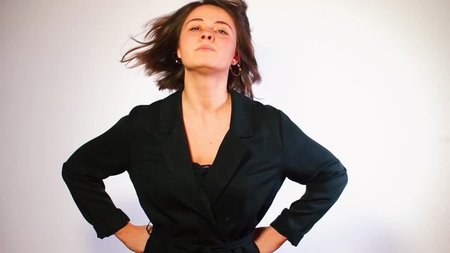 Dominant housewife in black clothes swears at a man.