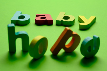 Word BABY HOPE on green background.Learning the English alphabet and language.The concept of child education, school, kindergarten