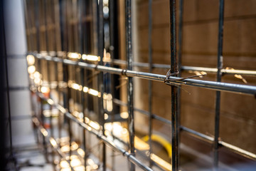 Reinforcement of concrete work. Using steel wire for securing steel bars with wire rod for reinforcement of concrete or cement. Selective focus..