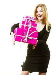 Happy surprised woman with many gifts