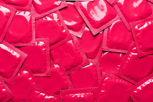 Blank red square condom sachets background top view