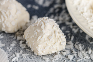 Making Homemade sweets from white chocolate with coconut. Candies. Delicious healthy dessert. Selective focus