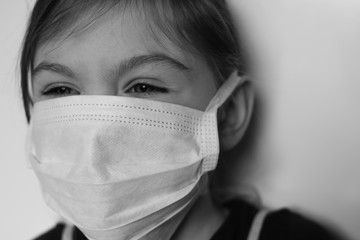 Child in a medical mask. Portrait, close-up. 
