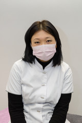 portrait of asian woman with medical mask on her face