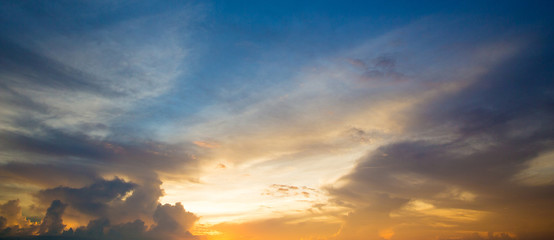 Sunset with sun rays, sky with clouds and sun